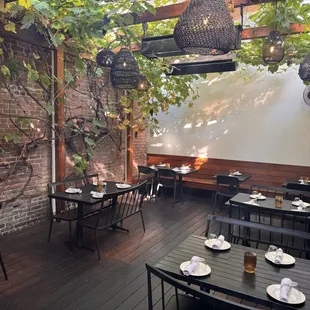 The Back Patio where you can dine under the grapevines.