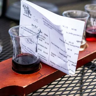 a glass of wine and a menu