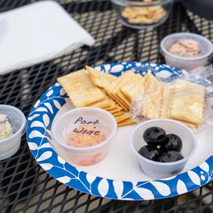a plate of crackers and dips