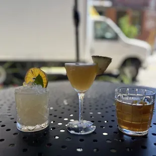 three different drinks on a table