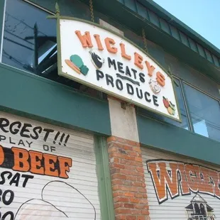 a sign for wigley's meats produce