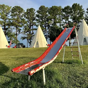 Lots of fun playground gear for young kids- little merry go rounds, parallel bars, a wooden pirate ship, etc.
