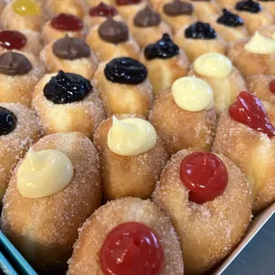 Soft, sugary, delicious malasadas! Mini or regular, filled or non filled.