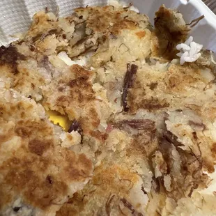 Mashed potato patty with strands of corned beef