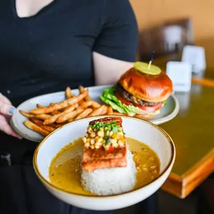 a woman holding a plate of food