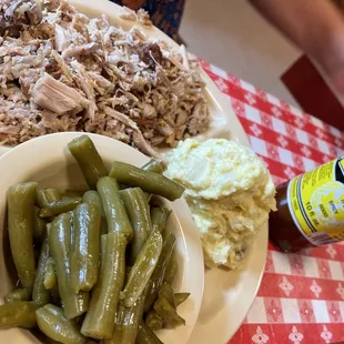 BBQ platter with a side of green beans and potato salad