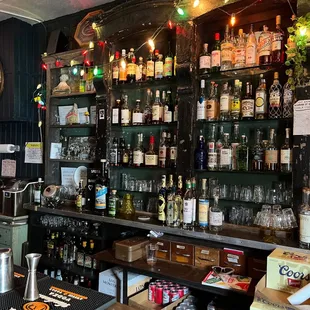 a bar with bottles of alcohol