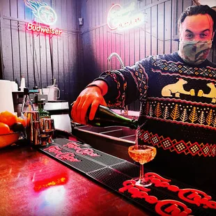 a bartender pouring a drink