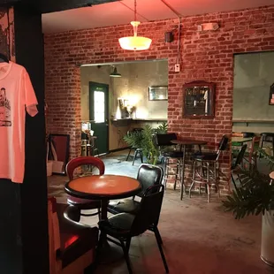 a t - shirt hanging on a brick wall