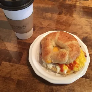 a breakfast sandwich and a coffee