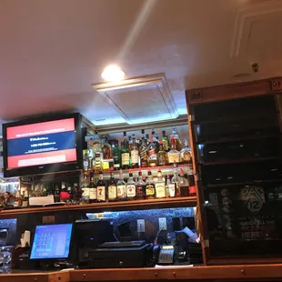 a bar with a laptop on the counter