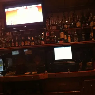 a bar with a television on the wall