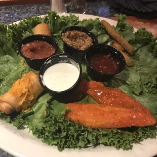 Appetizer sampler plate. Half eaten! The mini chimis were the best!