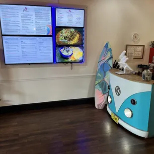 Super cute ordering station with digital menu on the wall.