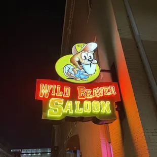 a neon sign for wild beaver saloon