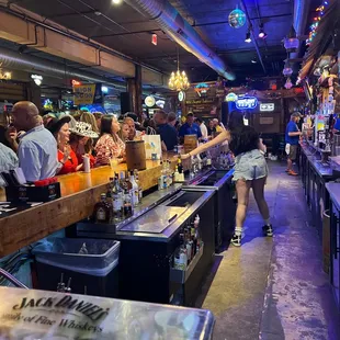 a crowd of people at the bar