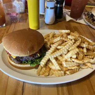 a hamburger and fries on a plate