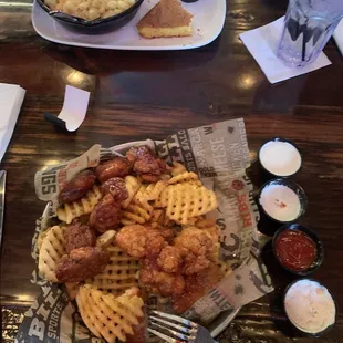 16 Boneless Wings over Waffle Fries  Gouda Mac-N-Cheese