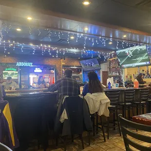 people sitting at the bar