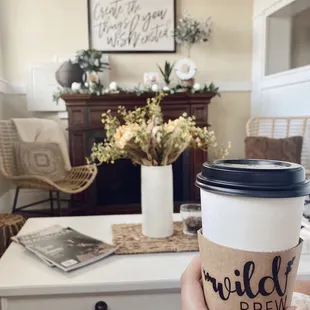 a person holding a coffee cup