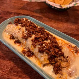 a plate of chips and a bowl of tortillas