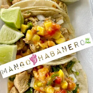 a plate of tacos and salsa
