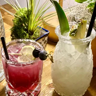 two cocktails on a table