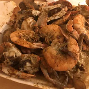 Large spicy garlic crabs with potatoes, corn, and sausage. I added 6 shrimp.