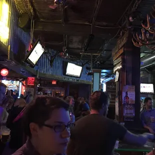 a crowd of people at a bar