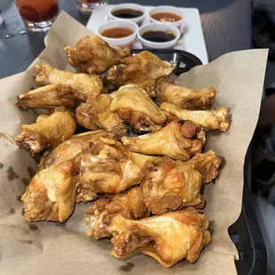 Traditional wings with sides of mango habanero and teriyaki.