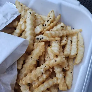 Fries covered in old burnt food