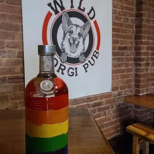 a rainbow colored bottle of liquor