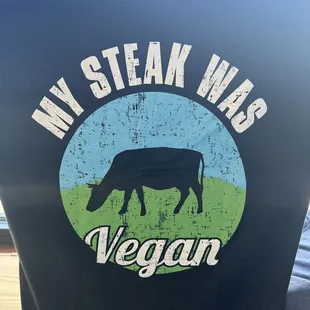 a man wearing a t - shirt that says, my steak was vegan