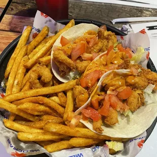 Shrimp tacos. They were okay, it was a basic taco. But, the fries were amazing!!!