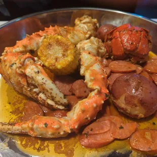 Crab legs n Lobster tail. With corn n potatoes , sausage is extra.