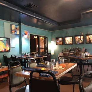 a dining room with tables and chairs