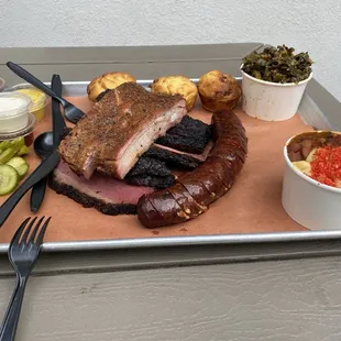 Homemade pickles, assorted sauces, cornbread, collards, chili mac, ribs, sausage, pastrami &amp; brisket!