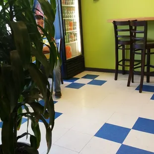 a green and blue checkered floor in a restaurant