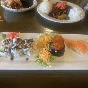 Sushi selections. Eel and Avocado Roll and some salmon egg and salmon sushi.
