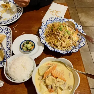 a variety of dishes of food on a table