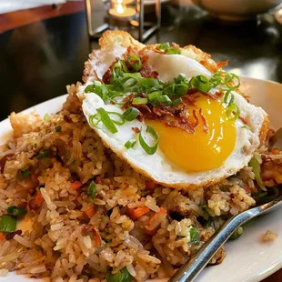 fried rice with an egg on top