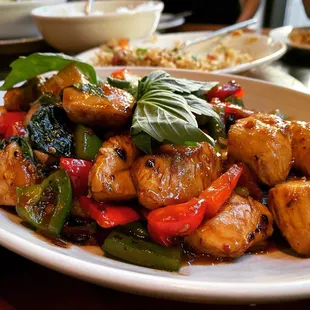 a plate of chicken and vegetables