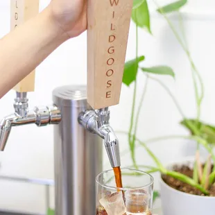 a person pouring a drink