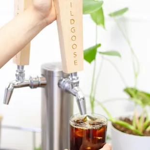 a person pouring a drink