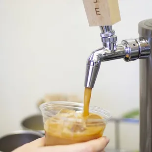 a person pouring a drink