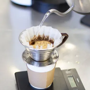 coffee being poured into a cup