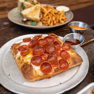 Try our Sicilian pizzas! Available in full pies and personal slices. Pro tip: Add burrata &amp; hot honey.