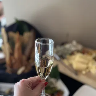  person holding a glass of wine