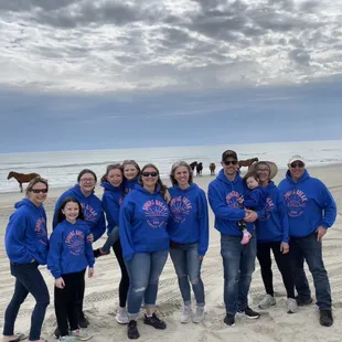 The family with horses on the beach