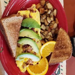 3 egg omelet with bacon, pepper jack cheese, avocado and mushrooms. Side of home fries and wheat toast.